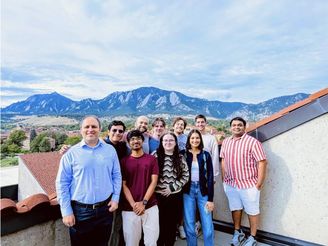 QUASAR Lab members on a rooftop at CU Boulder with the Flatirons in the background